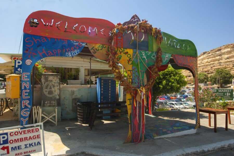 Crete: Matala Beach and Hippie caves, Red beach - Matala village breaks: murals, shops, and a fast Greek-food plan